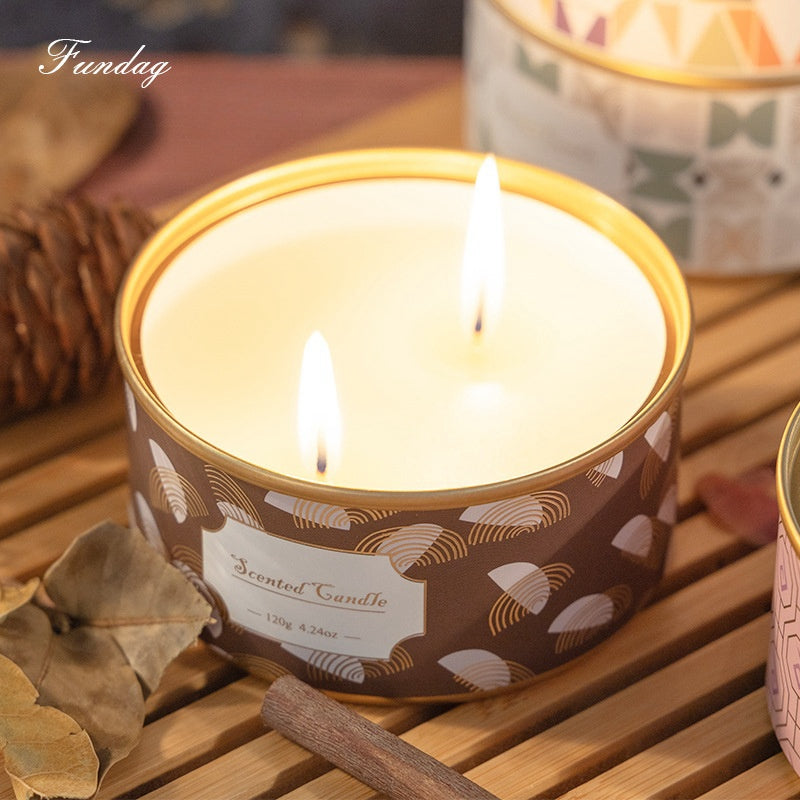 On the Go Traveling Tin Can Scented Candle creating a romantic ambiance in a cozy living room, perfect for a relaxing evening.